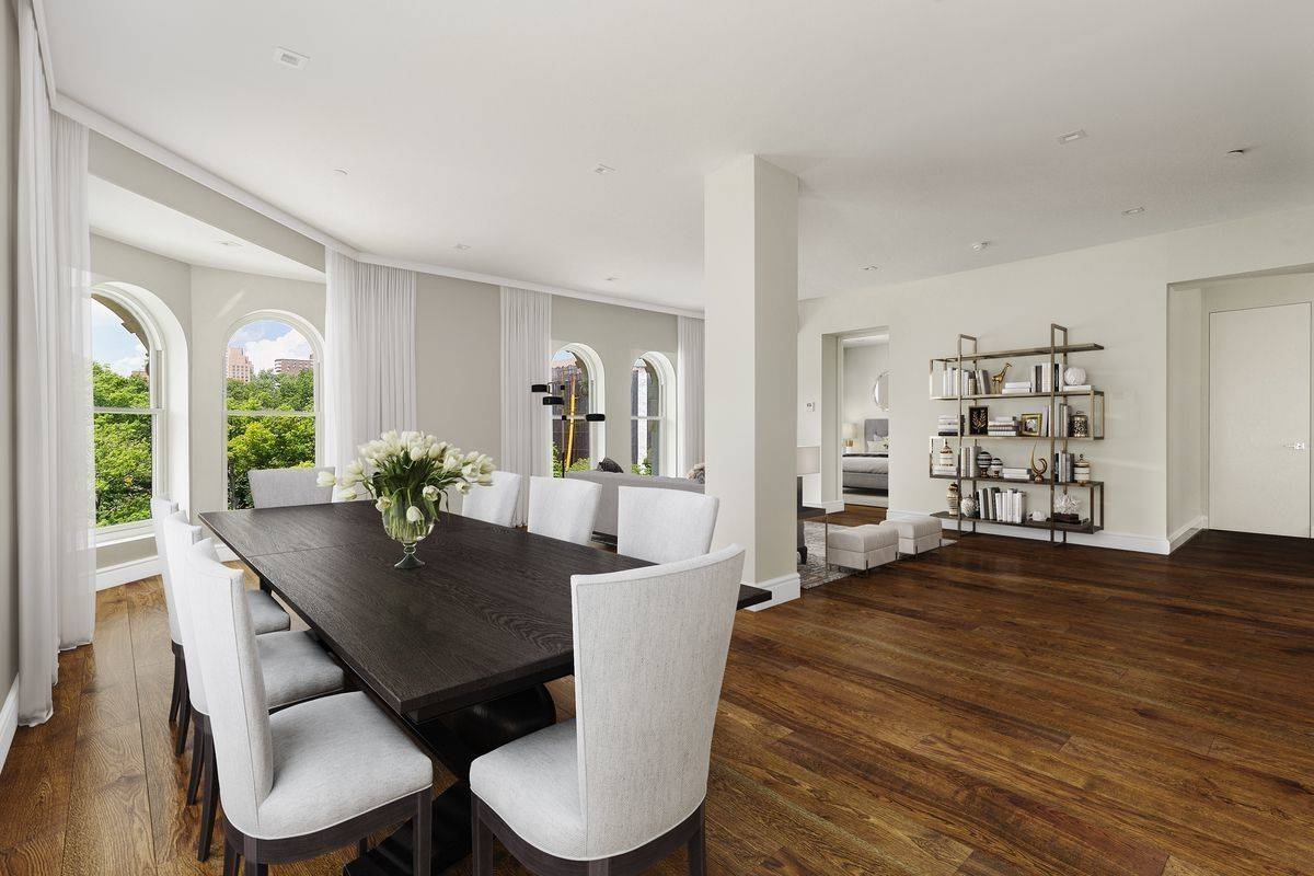 Enter into 92 Morningside's grandest living room lined with oversized Park facing windows.