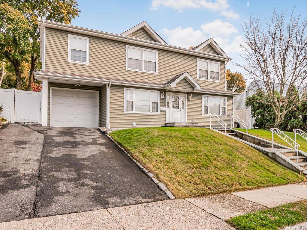 Large newly renovated 4 bedroom, 3 bathroom home, featuring an en suite bathroom, Open floor plan with cherry wood cabinets, Stainless Steel appliances, and a fully finished basement.