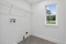 Upstairs with gas dryer and washer hook-up with 24x24 tile flooring