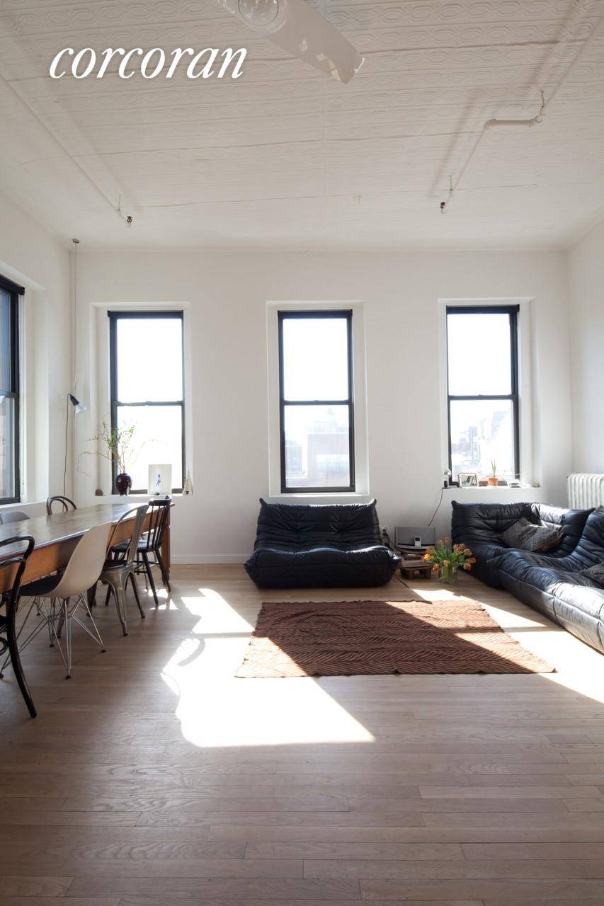 FURNISHED TOP FLOOR CORNER 2 BEDROOM LOFT with UNOBSTRUCTED SOUTH and WEST VIEWS through 9 OVERSIZED WINDOWS over SOHO and the BOWERY !