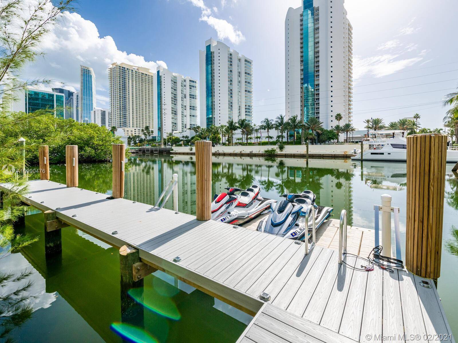 The perfect modern style waterfront pool home just steps to the Beach.