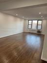 Unfurnished room with radiator, baseboards, a wall unit AC, recessed lighting, and dark wood-style floors