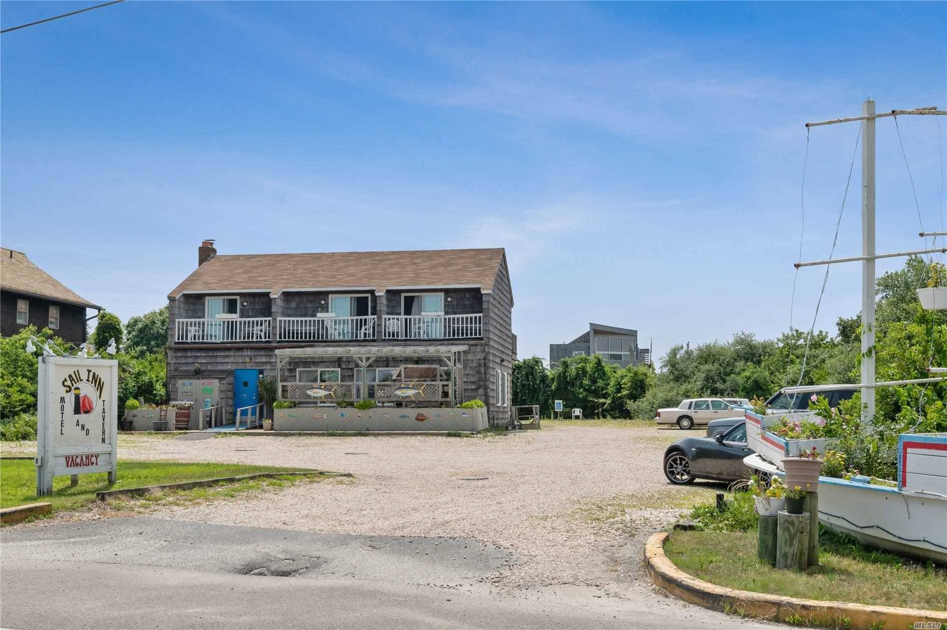 Established restaurant bar with outside patio and 10 en suite oversized motel rooms, oversized septic system and 27 private parking spaces, public water, Central Business zoned, 1, 188 sq.