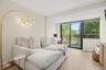 The spacious second bedroom features a charming Juliet balcony, abundant natural light, and convenient access to the beautifully appointed hall bathro