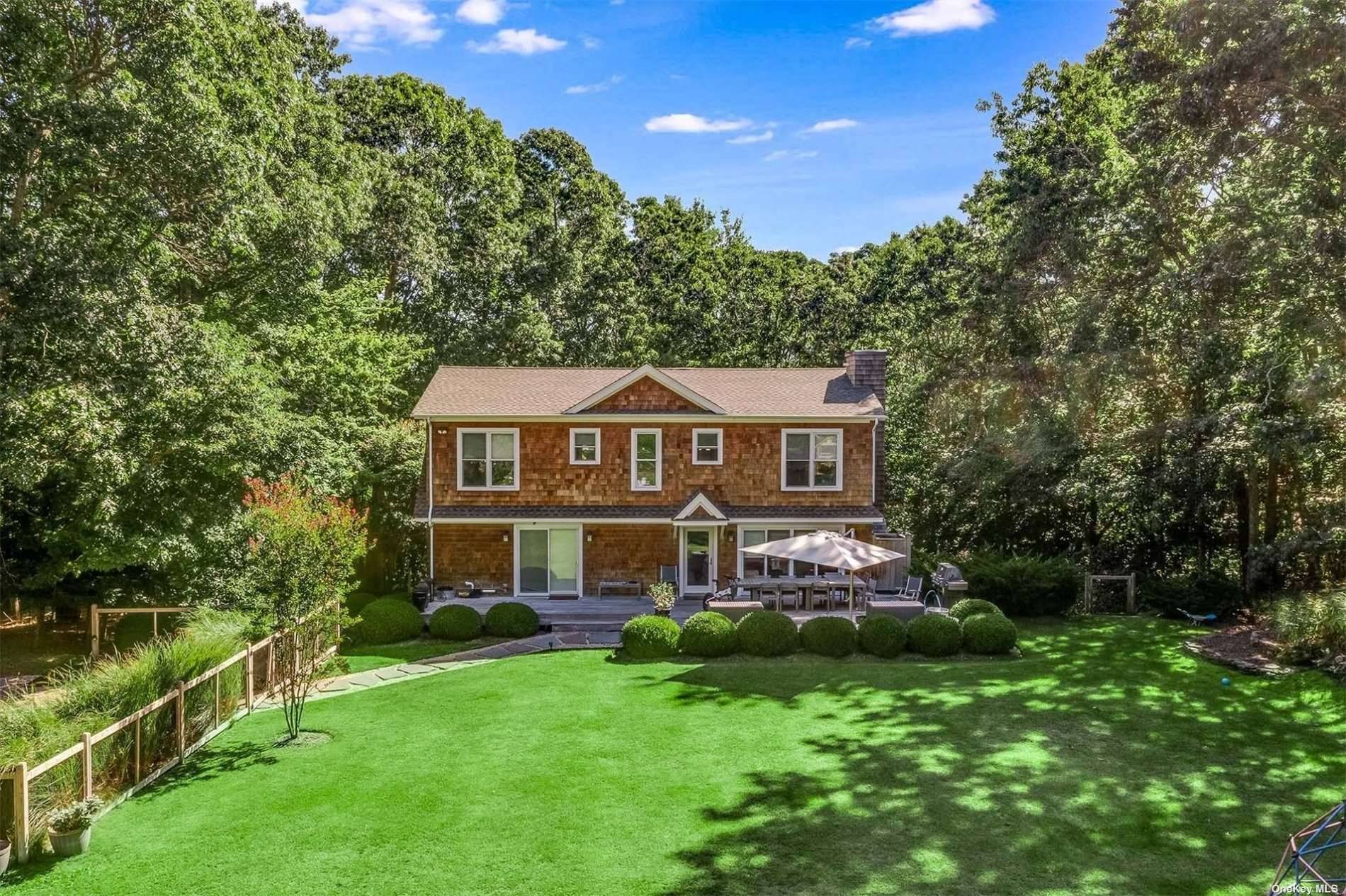 RP220711. This traditional home on 7 acres offers privacy and convenience with its proximity to Sag Harbor Village amenities.