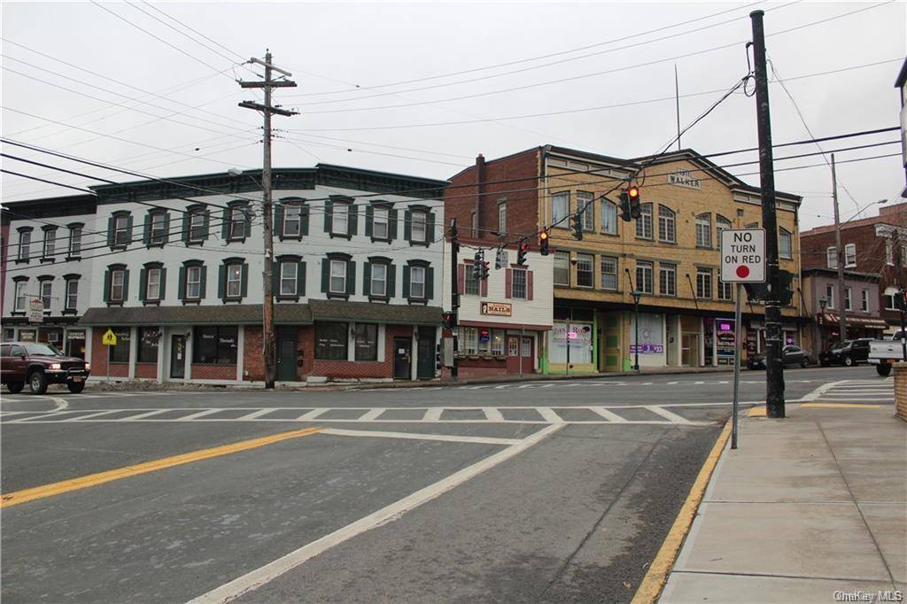 Mixed use building with two commercial spaces and 5 apartments, all apartments rented with long time tenants.