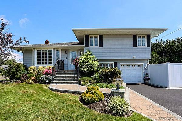 This beautifully updated home in Plainview, set within the desirable Bethpage School District, truly has it all.