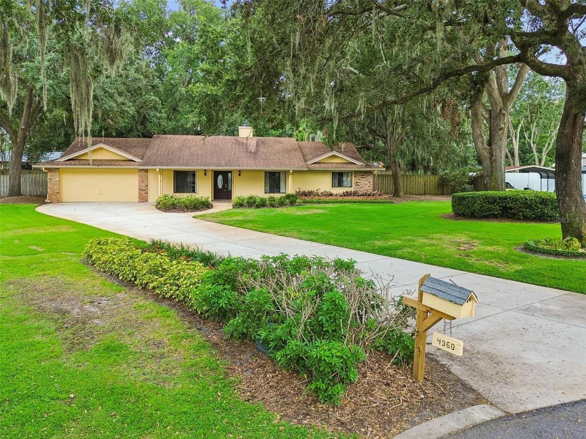 Meticulously maintained 4 bedroom, 2 bath home on .58 acres