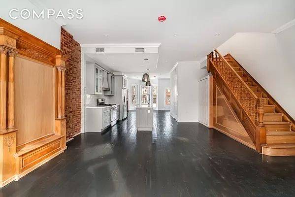 Stunning gut renovated townhouse with private full backyard in the center of exciting Crown Heights.
