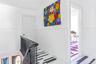 Stairway featuring wainscoting