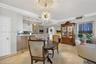 Beautiful sputnik chandelier, Storage closet (w/ Emtek crystal door hardware throughout unit), counter seating at kitchen. Crown molding.
