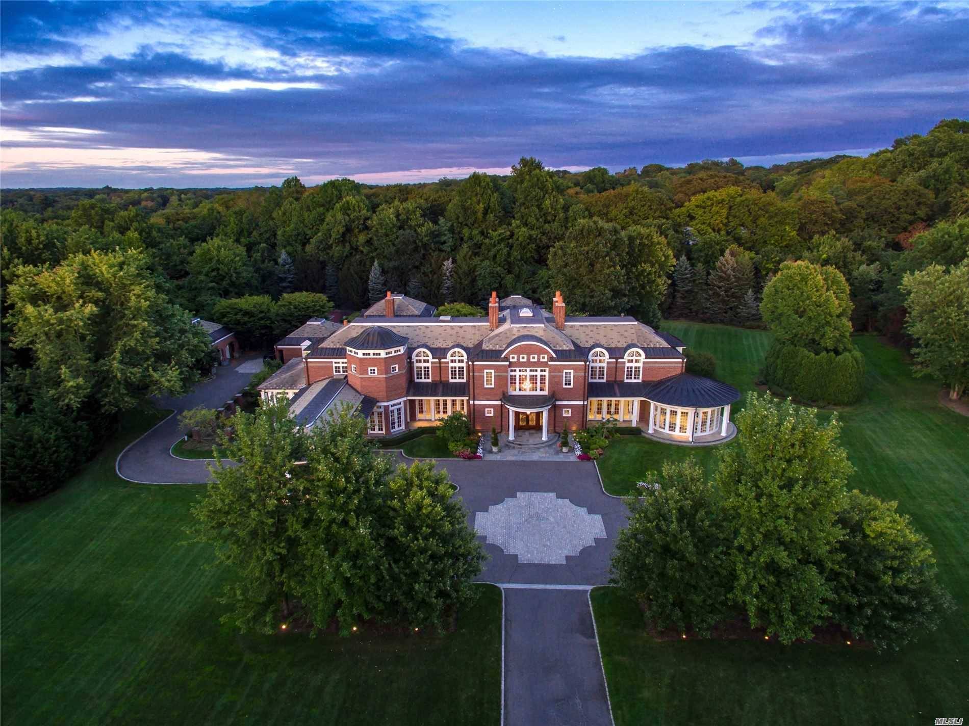 Situated on over 6 acres of perfectly manicured property and located on one of the most prestigious streets on the Gold Coast of Long Island, this custom built estate simply ...