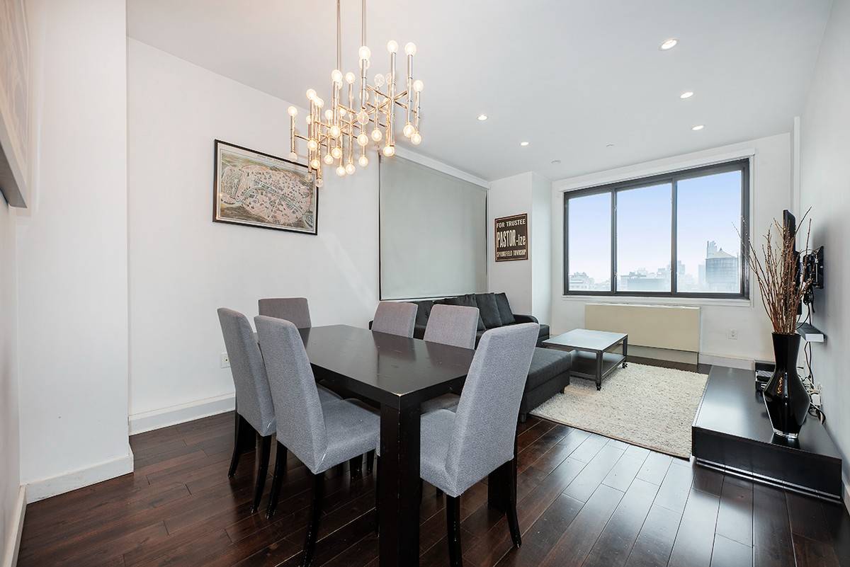 Perched high above the heart of downtown Manhattan, this spacious and sun filled top floor two bedroom home offers a great floorplan, a modern aesthetic, and breathtaking views of the ...