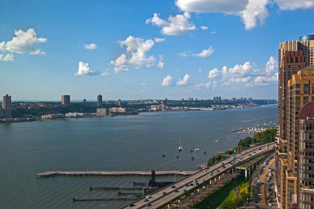 Immaculate Corner Two Bedroom Two Bath Residence with Stunning Hudson River and City Views !