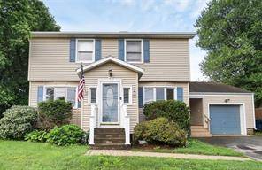 Welcome to this charming colonial home set on a double lot, complete with a sprawling lawn, tended bushes, and mature trees that provide shade and privacy.