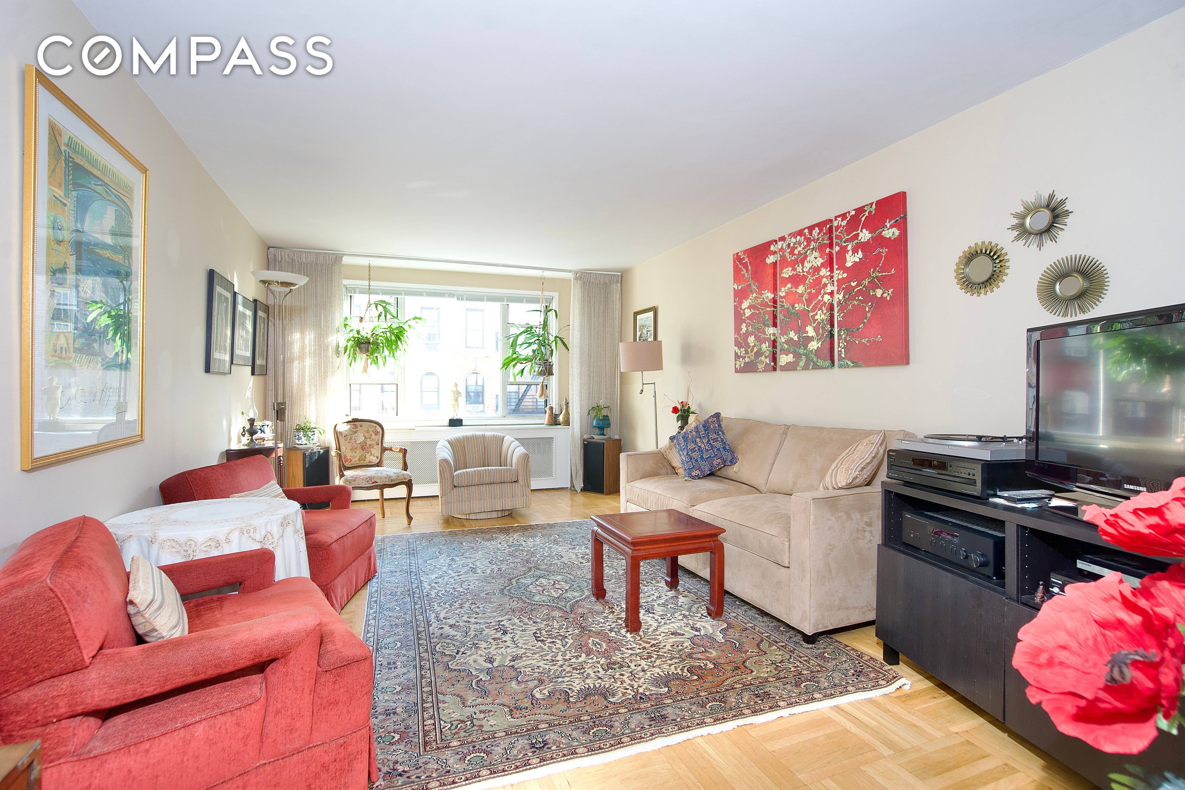 Welcome to this extra large and sunny corner one bedroom home with both southern and western exposures on leafy East 77th Street on the Upper East Side.