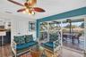 Family room with sliding glass doors opening to large outdoor deck