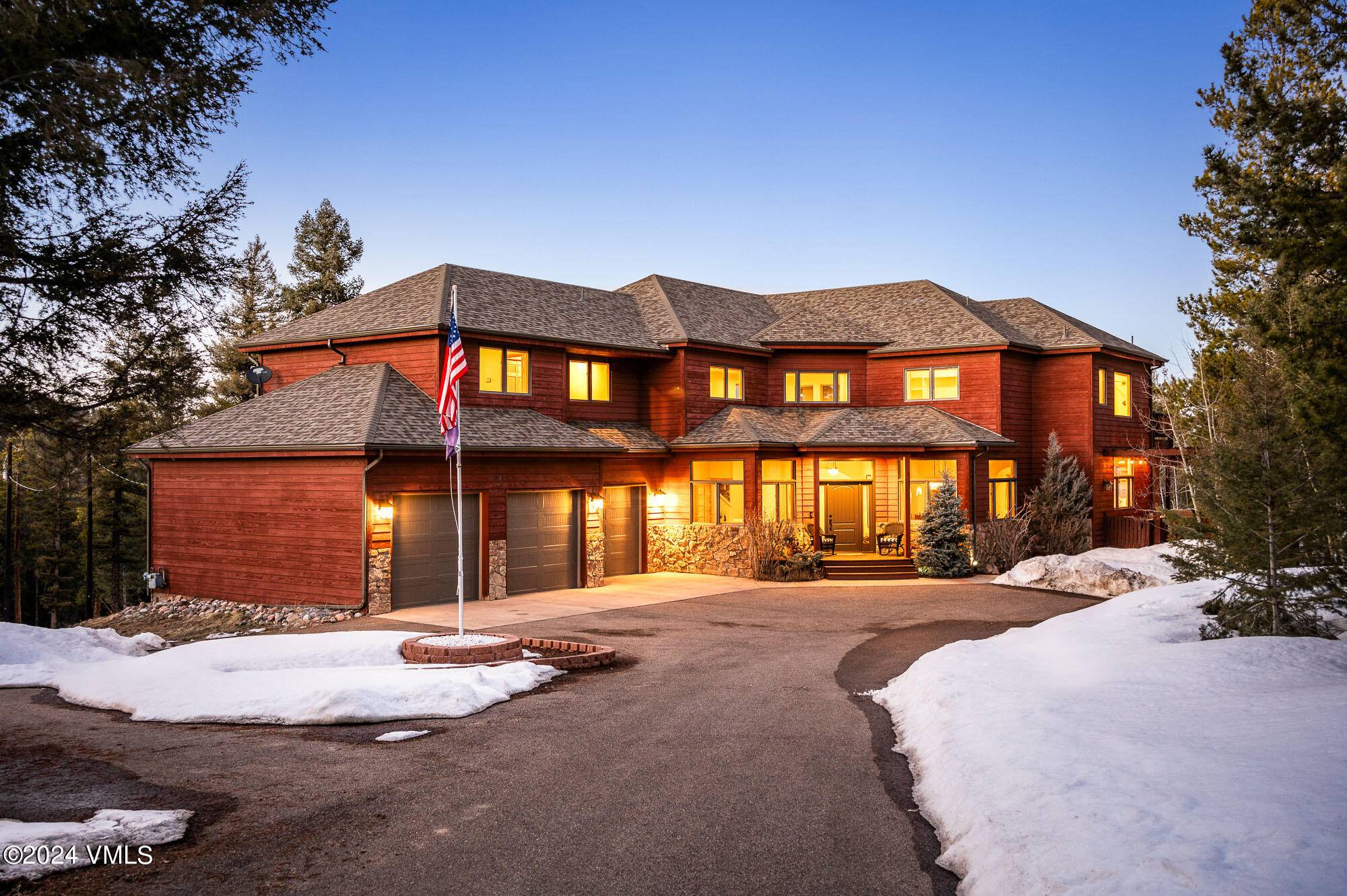 Nestled in the heart of Conifer's highly coveted mountain community, this custom built contemporary home offers unparalleled luxury living amidst 10 acres of breathtaking natural beauty.