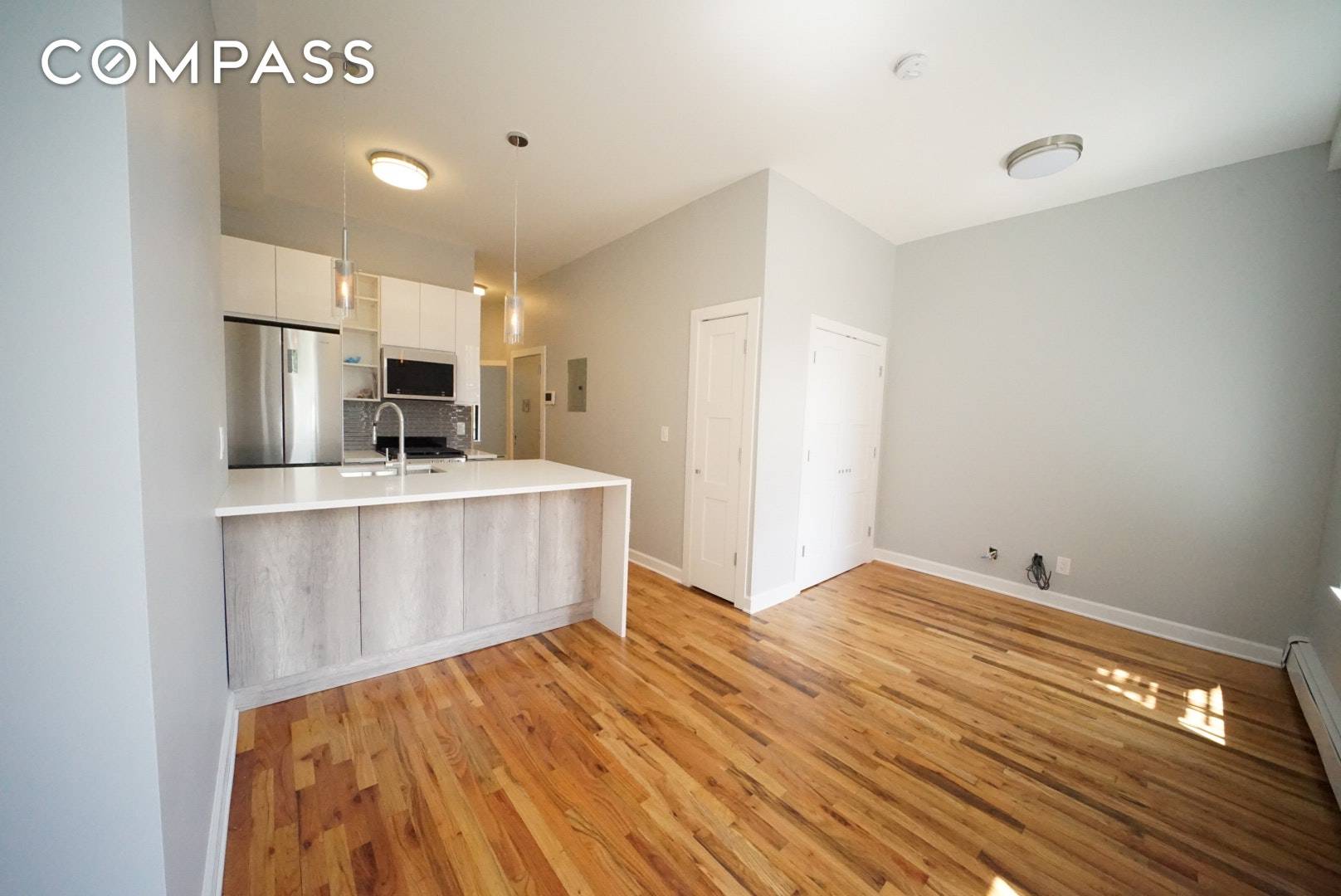 572 Myrtle Avenue is a brand new renovation featuring custom kitchen with huge quartz island and breakfast bar, stainless steel appliance package including dishwasher, and custom details throughout.