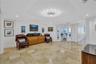 Bright and Cheerful - TV/Den Area - Travertine stone Floors and sharp modern lighting