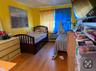 Bedroom with light hardwood / wood-style floors
