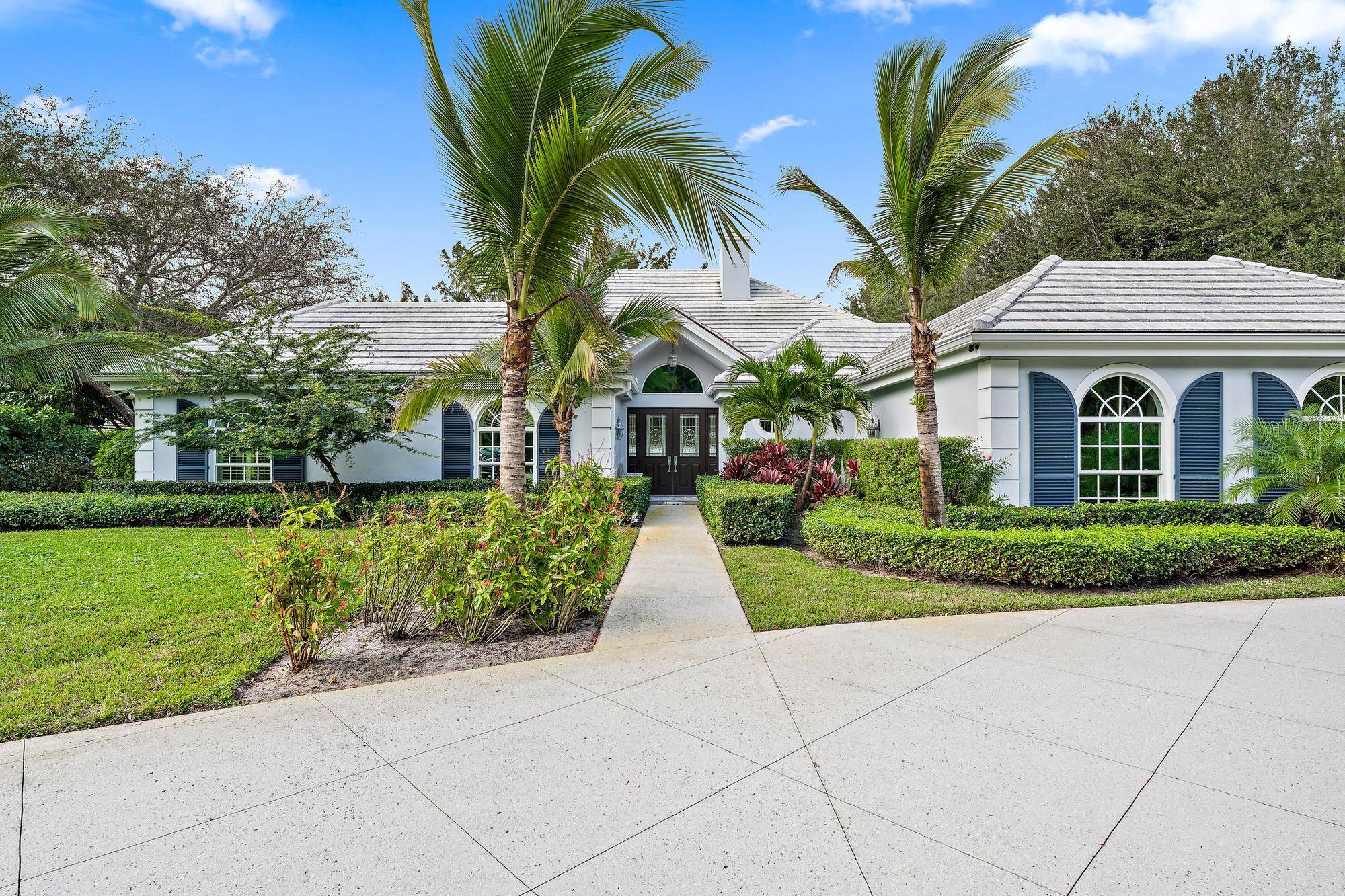 Welcome to this exceptional home within the coveted Seminole Landing community of North Palm Beach.