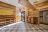 Misc room with tile patterned floors, wainscoting, recessed lighting, and wood walls