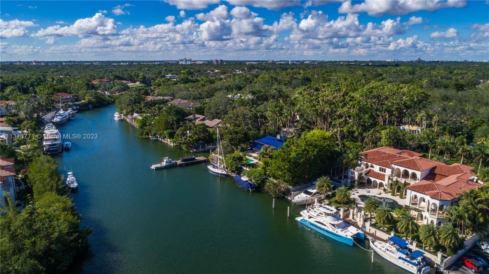 Located on prestigious Edgewater Drive, this elegant Mediterranean style estate spans an expansive 13, 889 sf and boasts 180 ft deep water frontage with private dock and 80 ft inlet ...