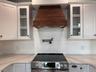 Custom hood vented to the outside. pot filler