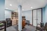 Home office featuring dark colored carpet and recessed lighting