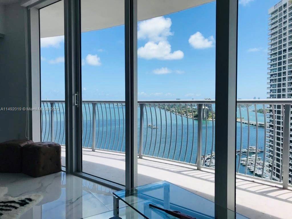 Stunning updated furnished 2 bedroom 2 bathroom residence in a 60 story tower offering breathtaking panoramic bay views and downtown from sunrise to sunset.