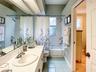 guest bath has a privacy door to the guest bedroom
