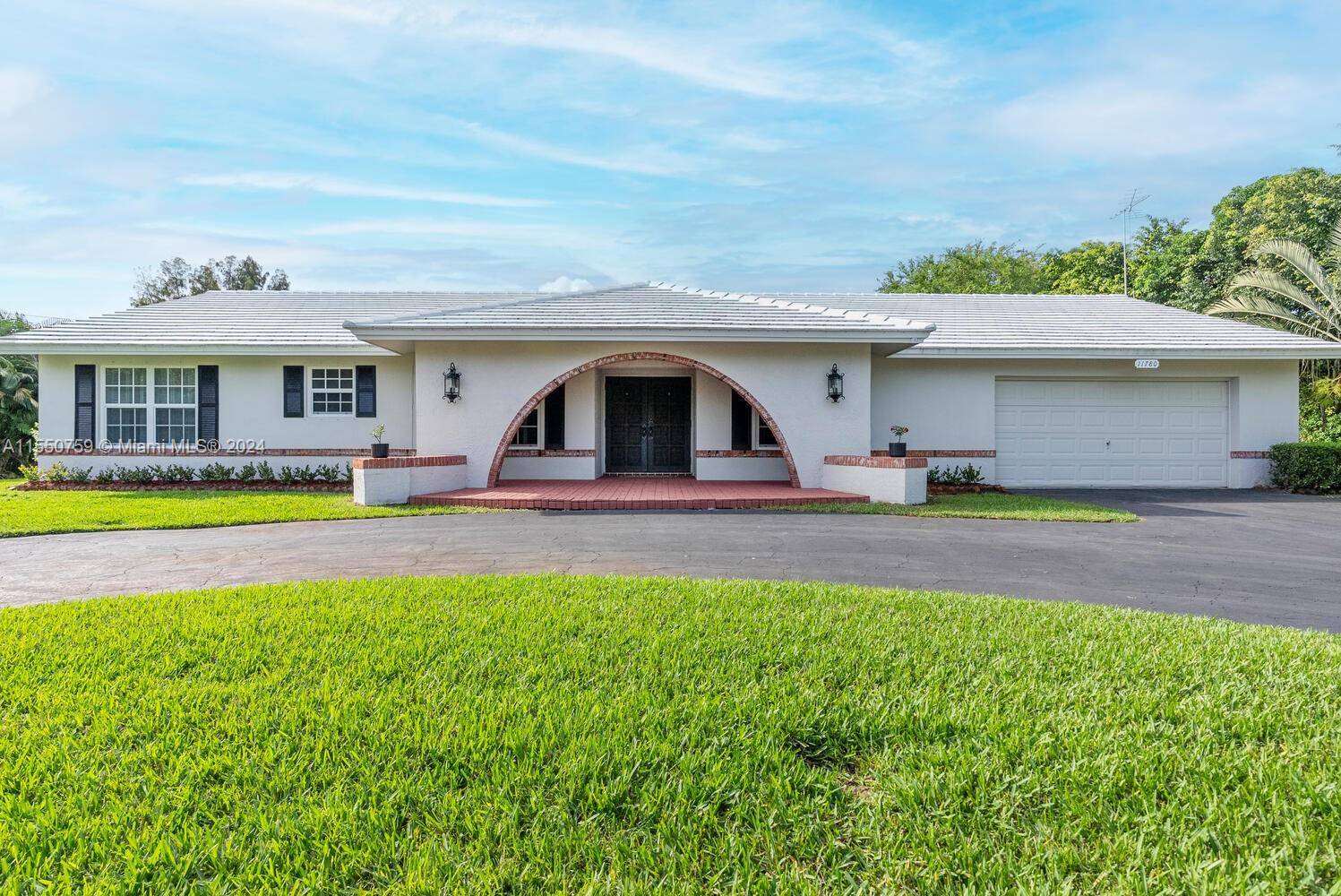 Immaculate pool home rarely available in Plantation Acres South !