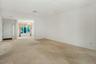 Long view of the living room to the dining area, & entry hall