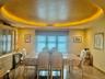 Dining room featuring a textured ceiling and a tray ceiling
