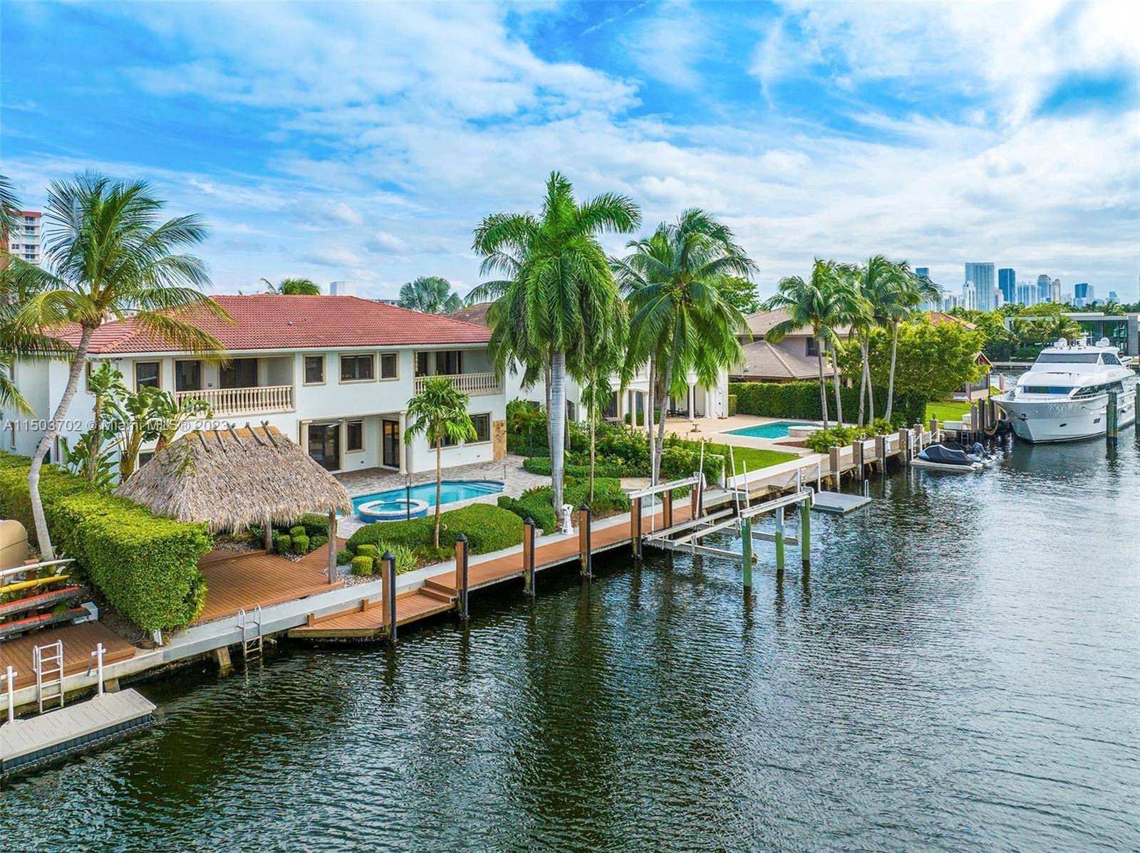 Two story waterfront home in Golden Isles, epitomizing South Florida s charm.