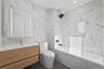Bathroom featuring tile walls, vanity, a combined bath / shower with marble appearance, recessed lighting, and dark tile patterned flooring