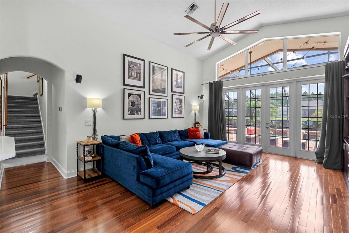 Spacious family room with cathedral ceilings and abundant natural light.