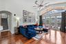 Spacious family room with cathedral ceilings and abundant natural light.