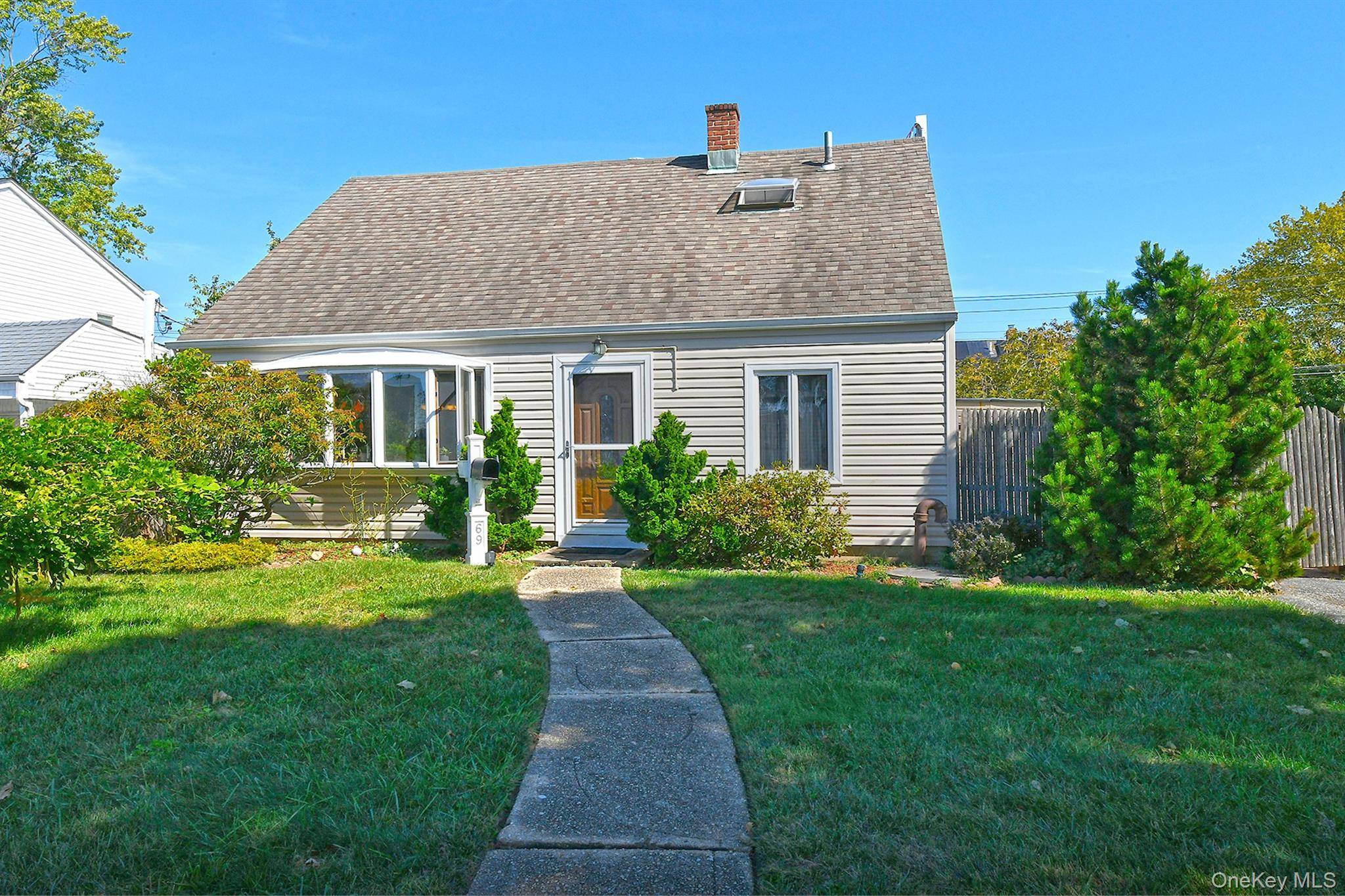 Charming, Expanded Cape Cod on Quiet Street.