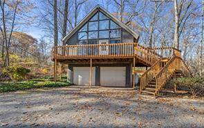 Welcome to your dream retreat nestled on a serene wooded lot a charming A frame home that seamlessly blends rustic beauty with modern comfort.
