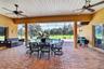 Expansive Covered & Screened Lanai with Paver Pool Deck