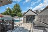 Converted garage, easy to convert back. Finished tile floor, folding glass doors, sub panel electic service