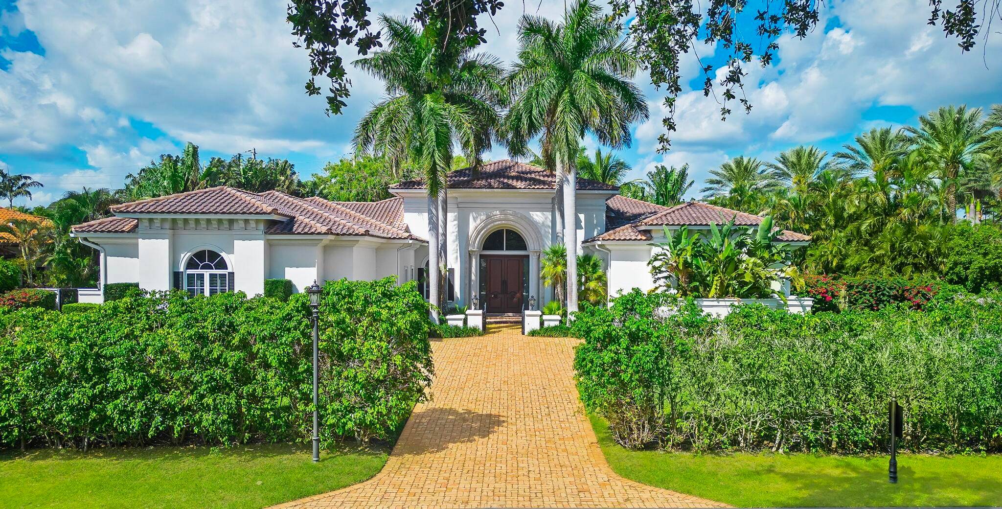 Introducing an extraordinary estate situated in The Sanctuary, one of Boca Raton's most coveted communities.