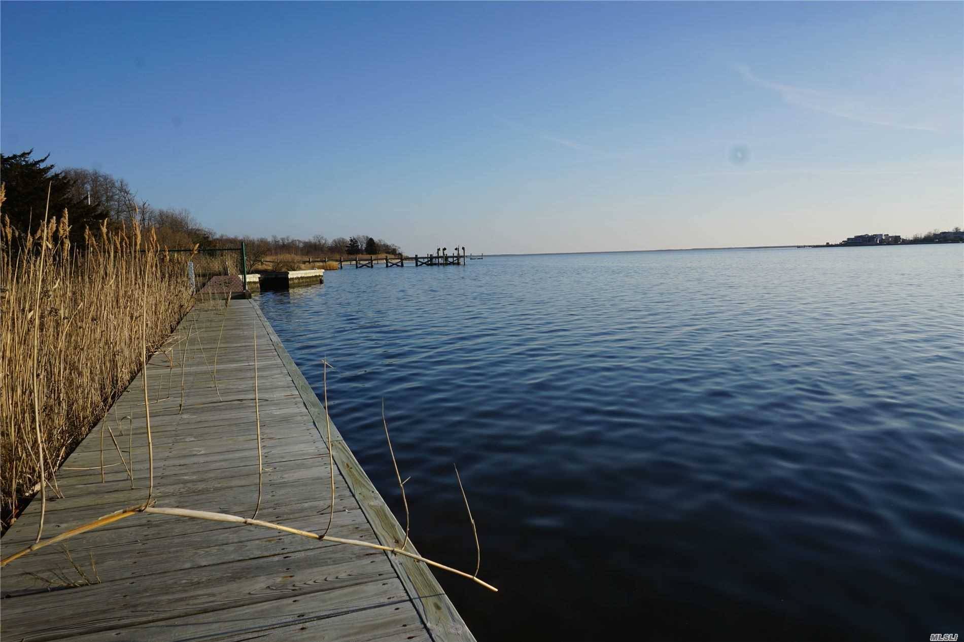 Nearly half an acre of waterfront property on the mouth of the Forge River leading into Moriches Bay along Long Island's south shore.