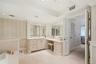 Another view of the upstair en suite bath showing the vanity and tray ceiling.