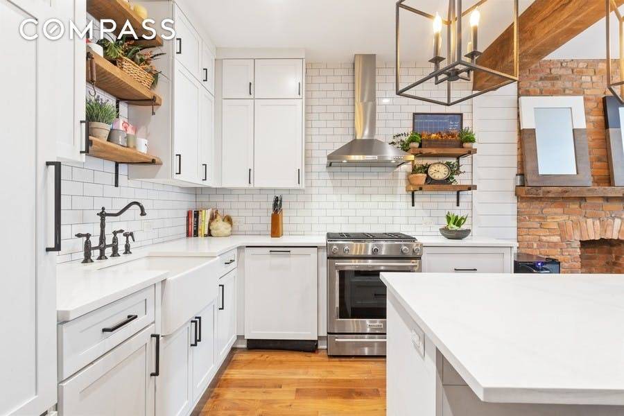 This impeccably renovated home maintains a rustic yet sophisticated aesthetic original wood beams and exposed brick integrate beautifully with the new wide panel solid walnut floor, spectacular kitchen, and iron ...