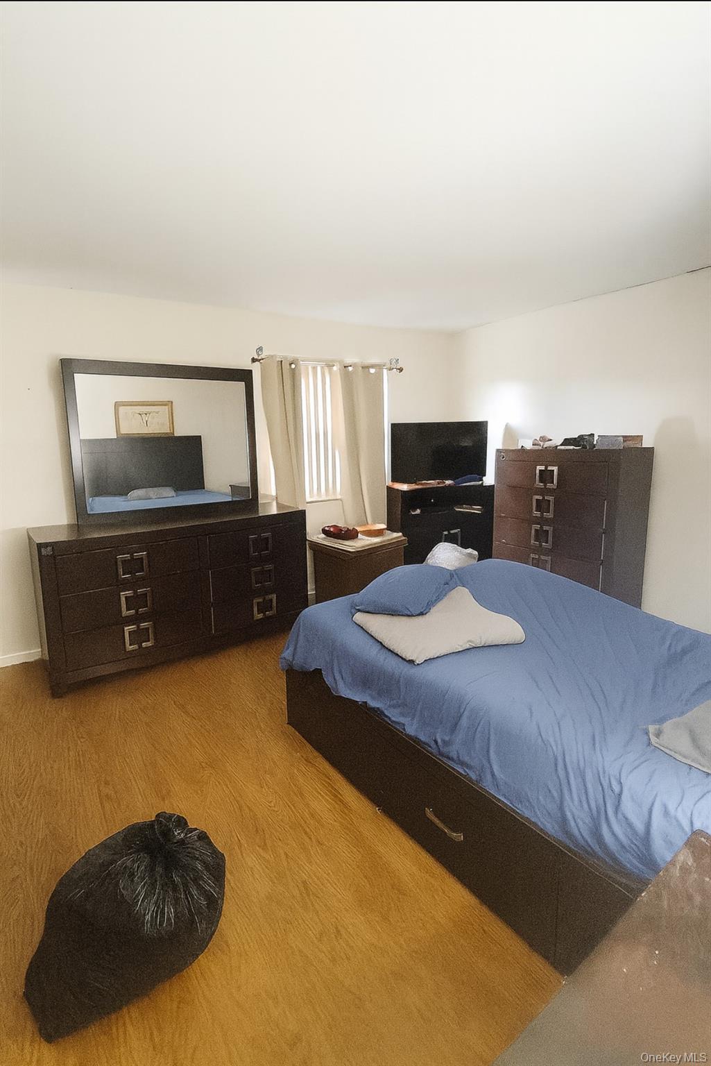 Bedroom featuring wood finished floors