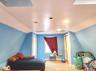 Carpeted bedroom featuring vaulted ceiling