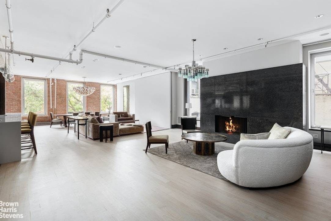 Nestled on a picturesque residential block in SoHo this exquisitely designed rental features 3, 500 sq ft 3BR 2.
